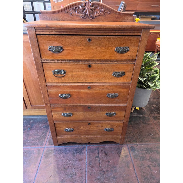A Solid Oak Arts & Crafts Mission Tall Chest Dresser American made. All drawers open easily and has just a touch of nice...