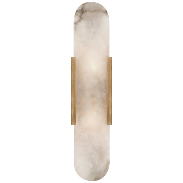 Melange Elongated Sconce in Antique-Burnished Brass with Alabaster Designer: Kelly Wearstler Height: 20" Extension: 3.5"...
