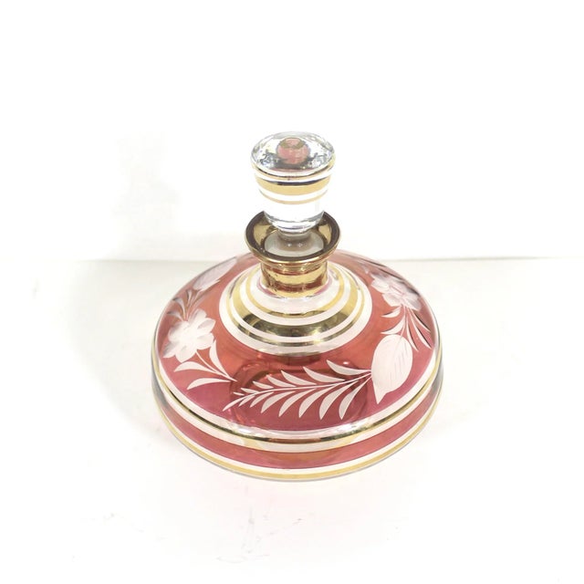 Very pretty Bohemian cut glass perfume bottle. Cranberry glass and gold bottle with stopper. Very good vintage condition,...