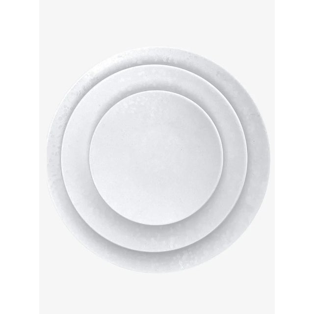 Set Of 4. Crafted in ceramic and enhanced with a distinctive reactive finish, this collection evokes the rich character of...