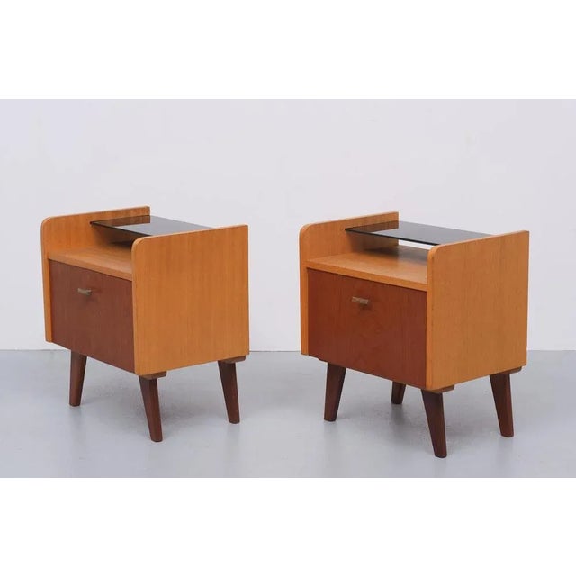 Two Teak nightstands. Comes with there original Black Glass tray. Good condition. Typical 1960s.