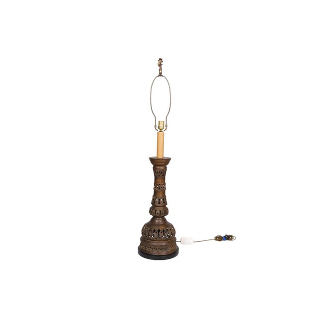 A large Japanese hand-crafted bronze temple candlestick holder converted to a table lamp, dating from the Meiji era...