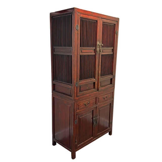 A beautiful example of Chinese vernacular furniture, this tall antique cabinet, often affectionately called a "Noodle...