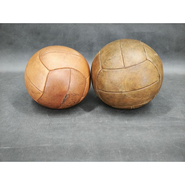 Rare set of two original leather medicine balls produced in Czechoslovakia during the 1950s. Featuring beautifully aged...