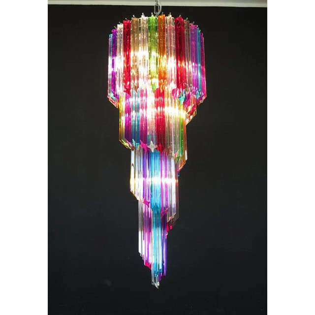 Fantastic vintage Murano chandelier made by 86 Murano crystal multi color prism in a nickel metal frame. The shape of this...
