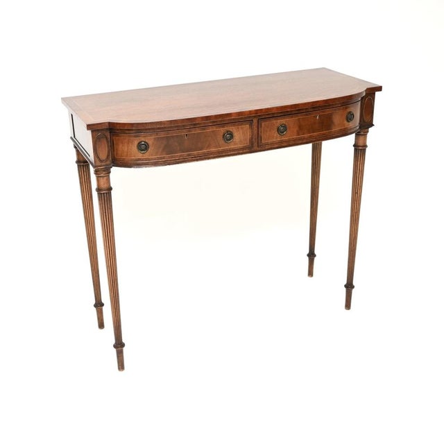 An outstanding antique Georgian style inlaid console table, made in England and dating from around the 1930’s. This is of...