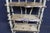 Rustic handcrafted Adirondack birch display shelf featuring three tiers, bark-on birch branch construction, and live-edge...