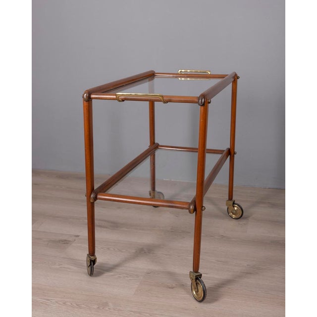 Wooden food trolley with gilded brass inserts, two glass shelves, Italian design, 1960s.