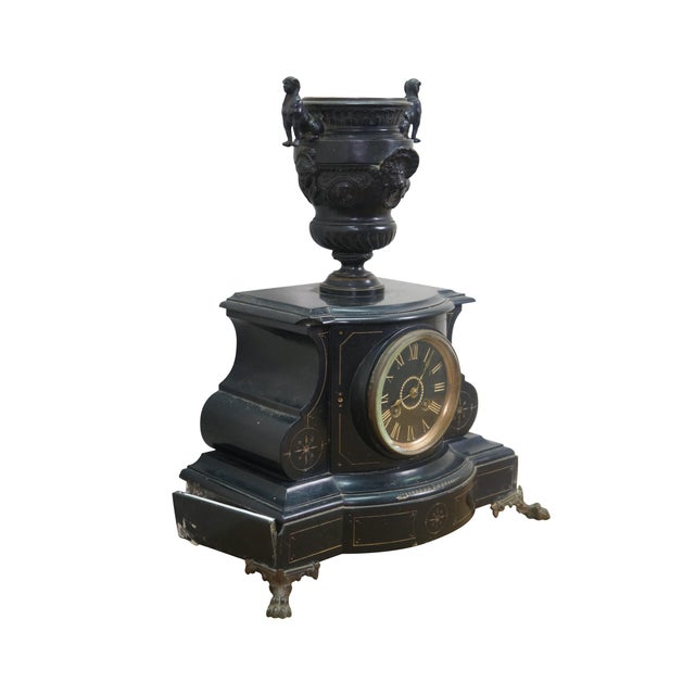 Antique Michelant & Laligant cassolette trophy urn mantle clock. Made with black slate featuring a bronze cassolette urn...