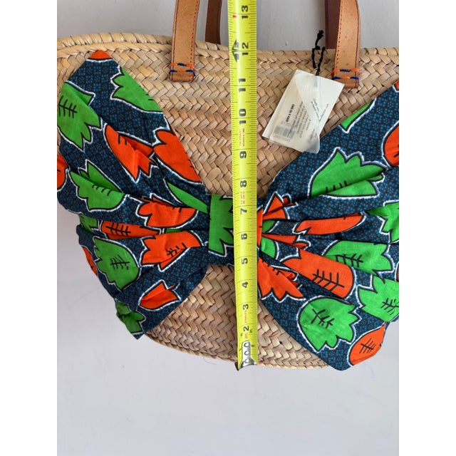 A Giselle Handwoven Straw Basket / Tote Featuring a Large Bow Made From Colorful Print and Brown Leather Shoulder Straps. For Sale - Image 10 of 12