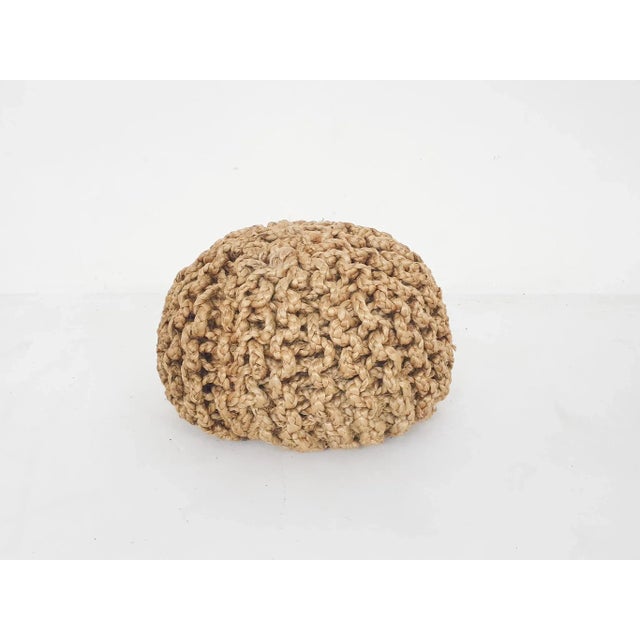 Ottoman or poof made of thick rope.