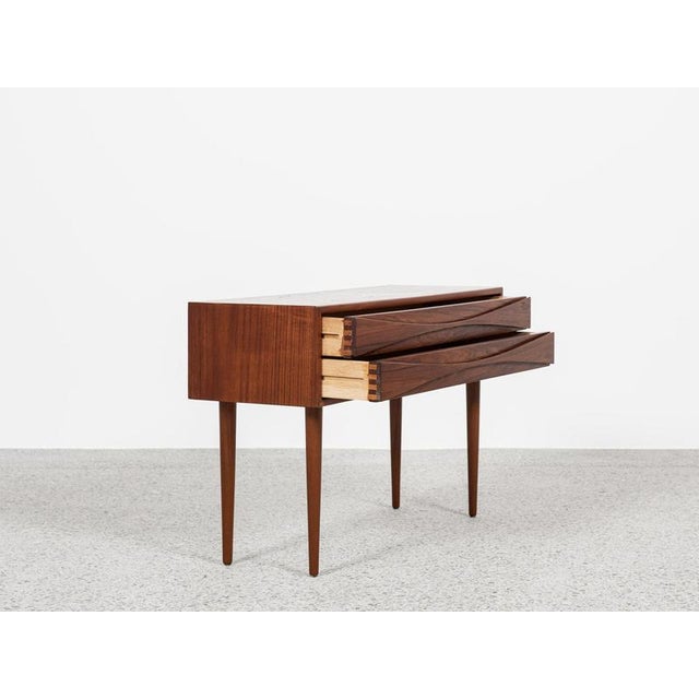 This chest of 2 drawers has been designed by Niels Clausen and manufactured by NC Møbler in the 1960s. A top piece! It...
