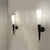A striking pair of large, slender torch-form wall lights, crafted in Italy during the 1960s in the style of Stilnovo. Each...