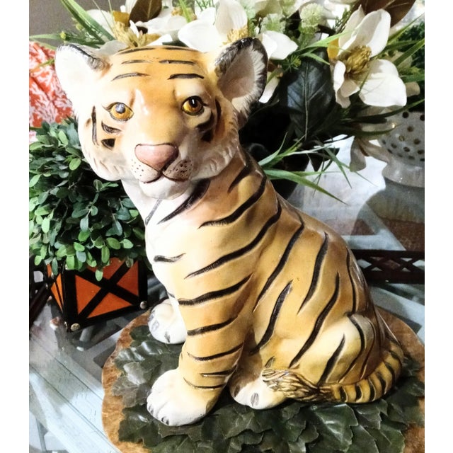 Sweet pretty large decorative tiger statue. The statue is very heavy and made of some sort of plaster material. He's a...