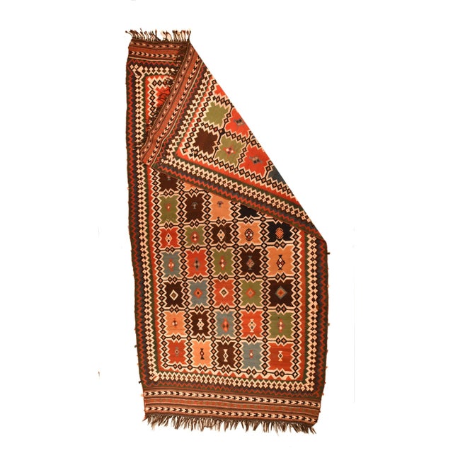 A five by ten matrix of notched panels on an ecru ground is defined by an orthogonal trellis of diamond chains. The panels...