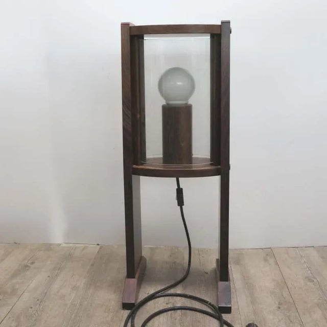 This Scandinavian vintage wooden floor lamp features vaulted glass panes. The discs are removable to change the bulbs....