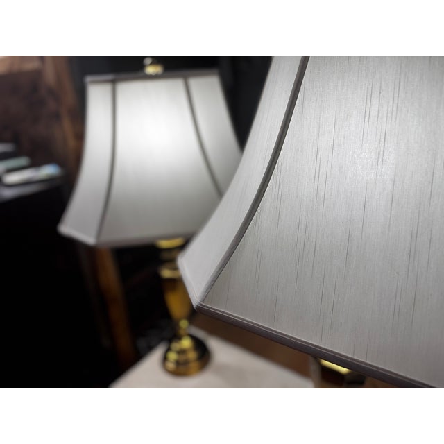 A classic matching set of vintage table lamps by Chapman Manufacturing Company. This pair features heavy, solid cast brass...