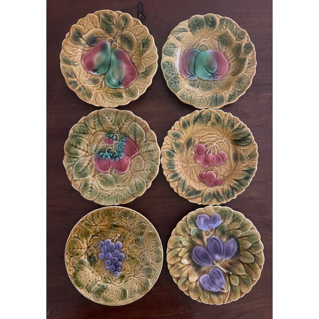 Large majolica serving set of 16 pieces in a fruit pattern made in France by Sarreguemines in the mid 20th century. The...