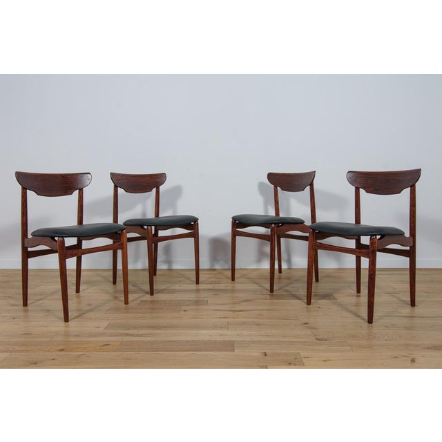 The set of four chairs was produced in Denmark in the 1960s. The chairs have an interesting form combined with high...