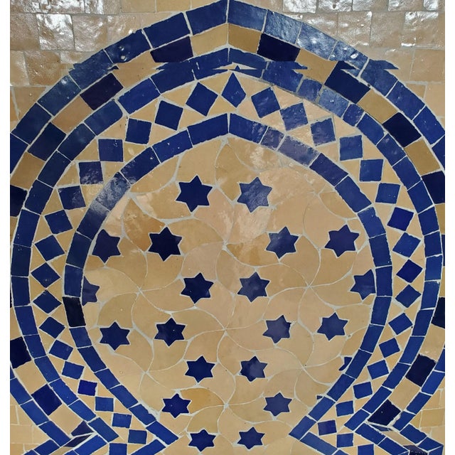 Blue and beige Rafraf Style mosaic fountain made in Morocco. Approximately 51” high and 30” wide, and comes with a copper...