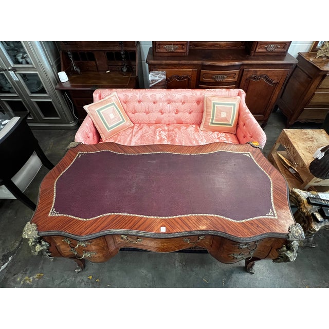 Modeled after the majestic Rococo designs of the 18th century, this double-sided executive desk is beautifully finished on...