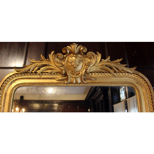 Napoleon III period gilt French Mirror, circa 1860. Repetitive motif borders – beading along the mirror plate followed by...