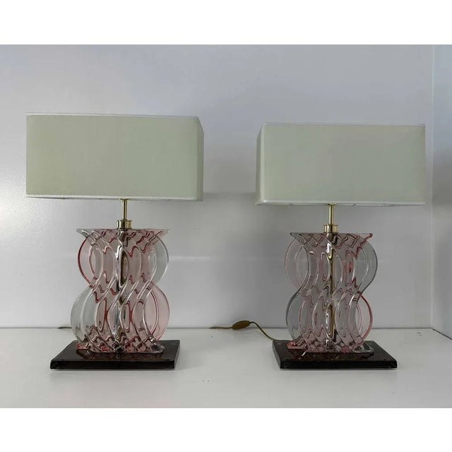 This pair of Art Deco Style lamps was produced in Italy in the 2000s. The central part of the structure is in gold...