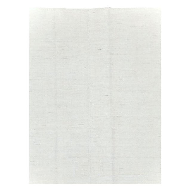 A vintage Turkish flatweave Kilim accent rug handmade during the mid-20th century. Measures: 6' 1" x 9' 7".