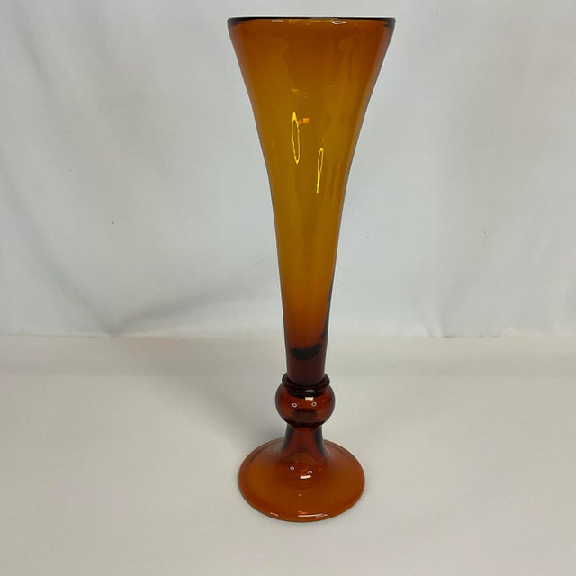 Vintage Home is pleased to offer this stunning Vintage Handblown Trumpet Vase. It stands 15” tall and is a gorgeous Amber...