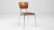 A wooden dining chair created in mid-20th century Germany. Ornate and well-postured, this smart dining chair projects an...