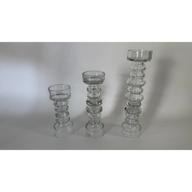 A striking graduated set of authentic Global Views hand-blown glass candlesticks, crafted in Portugal and retaining their...