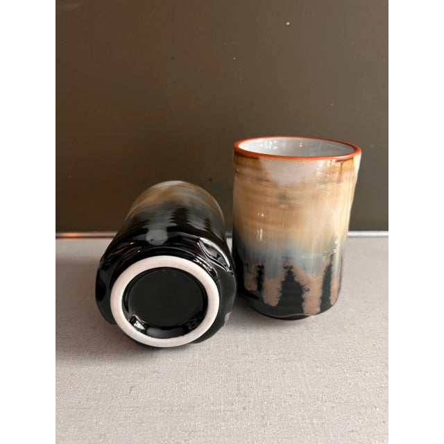 Pair of ceramic glazed vessels. Perfect for styling. Could be used as vases or drinking cups. Purchased at an estate sale....