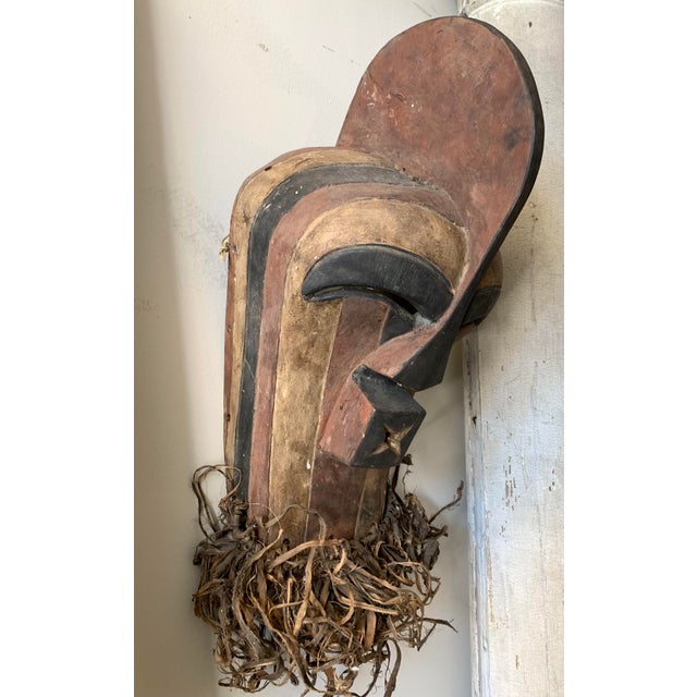 Striking handcarved wood African mask, believed to be Songye from Congo. Measures 24" tall including the unusual "beard"....