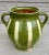 Beautiful in both its shape and decoration, this vintage glazed earthenware vessel is distinguished by its two handled...