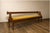 Exceptional antique reversible wood bench with a velvet-upholstered seat, dating to the late 1800s. At nine feet long, it...