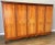 This impressive vintage French Louis wardrobe features a grand scale, elegant panelled doors, and beautifully shaped...