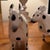 Cute Cows, made of metal and painted white with black polka dots. They eat little and don’t smell like most cows.