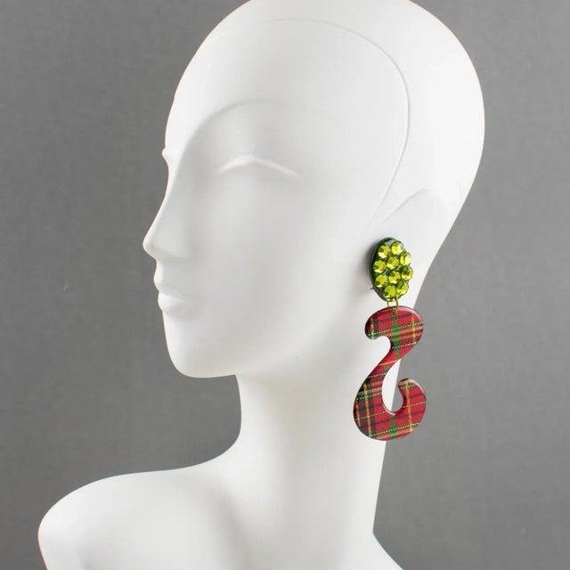 These impressive Italian Lucite or Resin dangling clip-on earrings feature an oversized chandelier shape with an "S"...