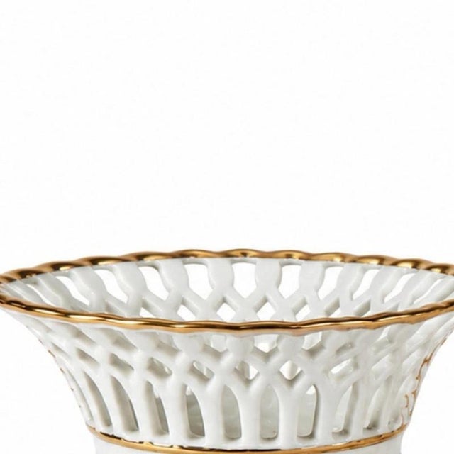 Porcelain - 2 Fruit Bowls. French; 20th century, molded and perforated porcelain with gold decoration. Dimensions: 9 cm x...