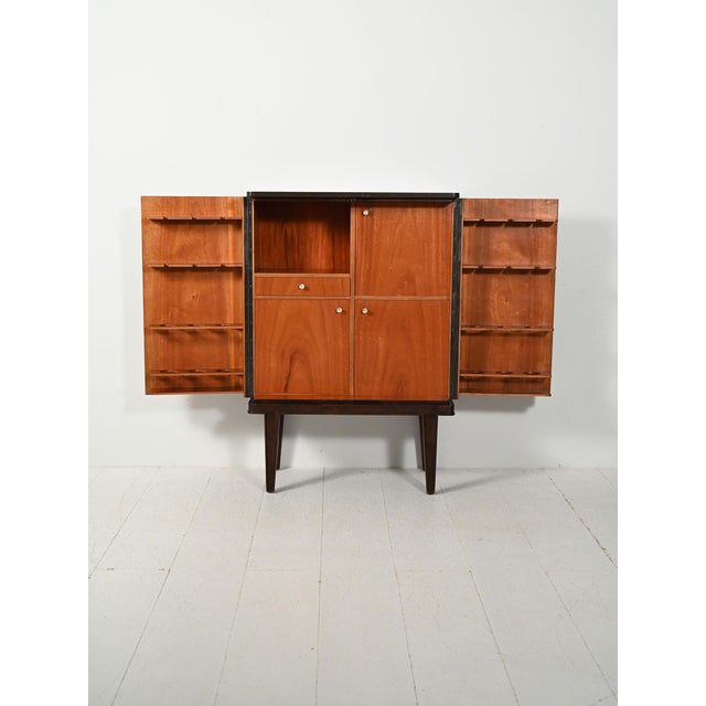 1940s Nordic bar cabinet in flamed mahogany with elegant figurative inlays and original fitted interior. Scandinavian bar...