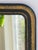A full length French Louis Philippe style mirror with an ornate black and gold frame. The mirror dates back to the end of...
