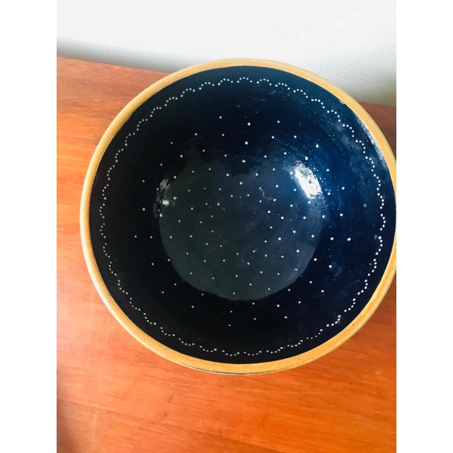 We love a good bowl! This one feature a dark blue interior with darling little white dots. No makers mark.