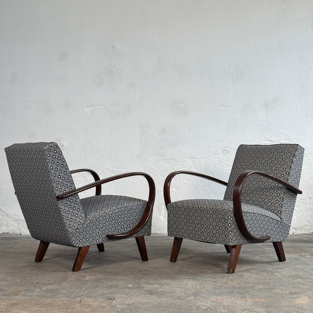 This rare pair of lounge armchairs is a defining masterpiece of european art deco and early modernist design, created by...