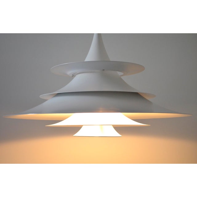 The Scandinavian pendant lamp was designed by Eric Baslev and produced by the company Fog & Mørup. This light is the XXL...