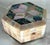 Incredibly iridescent mother of pearl veneered hexagonal box with star design on top. Push bottom locking mechanism, four...