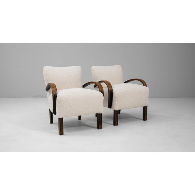This 1950s Czech pair of upholstered cocktail armchairs, model H-237 by Jind?ich Halabala, exemplifies the designers...