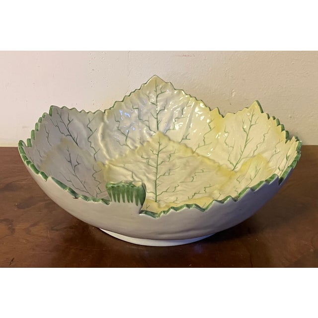 Large Portuguese majolica pottery leaf centerpiece or serving bowl in shades of green and yellow on a white ground....