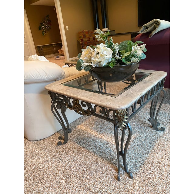 This Thomasville elegant table is made of high tempered glass and marble with ornate iron leg carvings. The design...