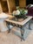 This Thomasville elegant table is made of high tempered glass and marble with ornate iron leg carvings. The design...