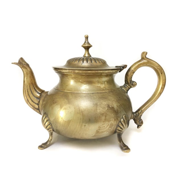 This vintage electro silver-plated teapot is a stunning example of craftsmanship from a bygone era. The teapot features a...